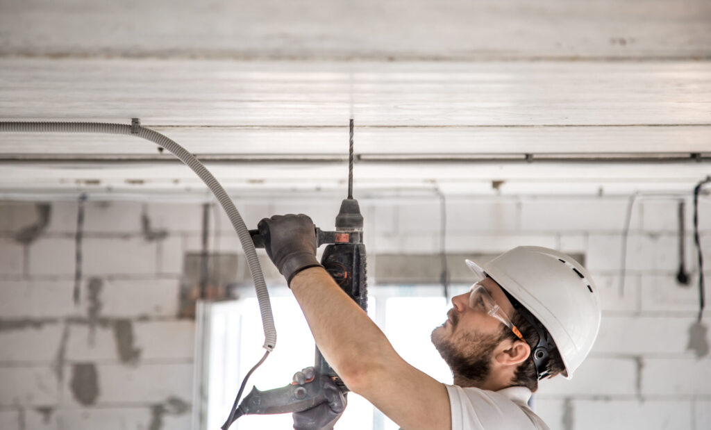 handyman uses jackhammer installation